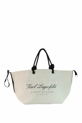 Tote bag beige de playa con logo hotel caligráfico